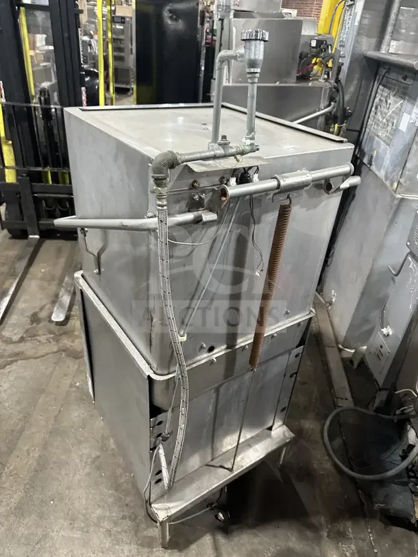 Hobart AM15 commercial stainless steel dishwashing machine, ventless, electric, high-temperature, on legs, good condition.