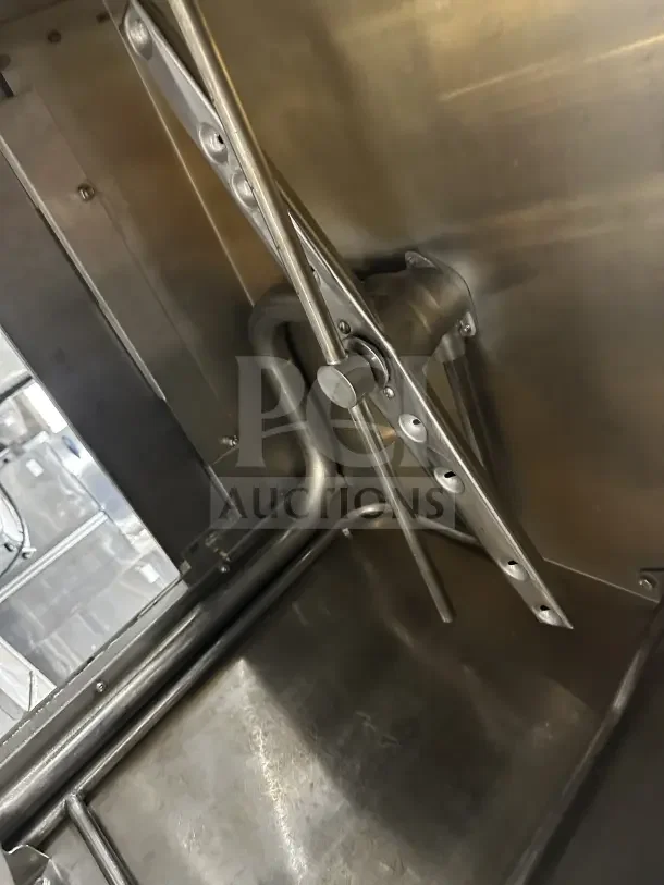 Hobart AM15 commercial stainless steel dishwasher interior view, ventless, high-temp, on legs, model details visible.