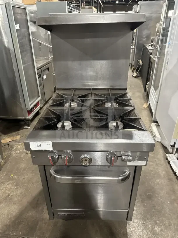 Southbend S241E stainless steel 4-burner range/oven combo with backsplash, overhead salamander shelf, and wired oven rack.