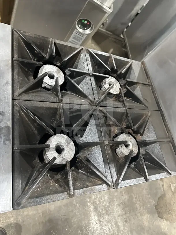 Southbend S241E commercial stainless steel 4-burner range/oven combo with backsplash, salamander shelf, on casters.