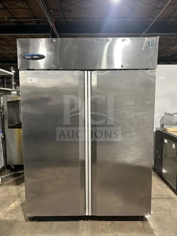 Hoshizaki Commercial 55" stainless steel two-section reach-in upright freezer, Model CF2S-FS, on casters, visible brand label.