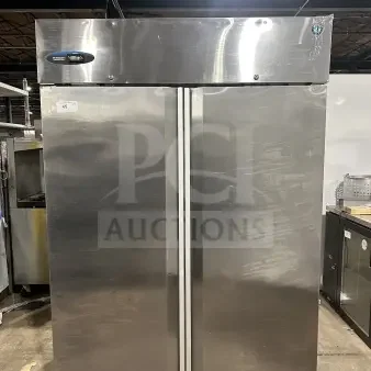 Hoshizaki Commercial 55" stainless steel two-section reach-in upright freezer, Model CF2S-FS, on casters, visible brand label.