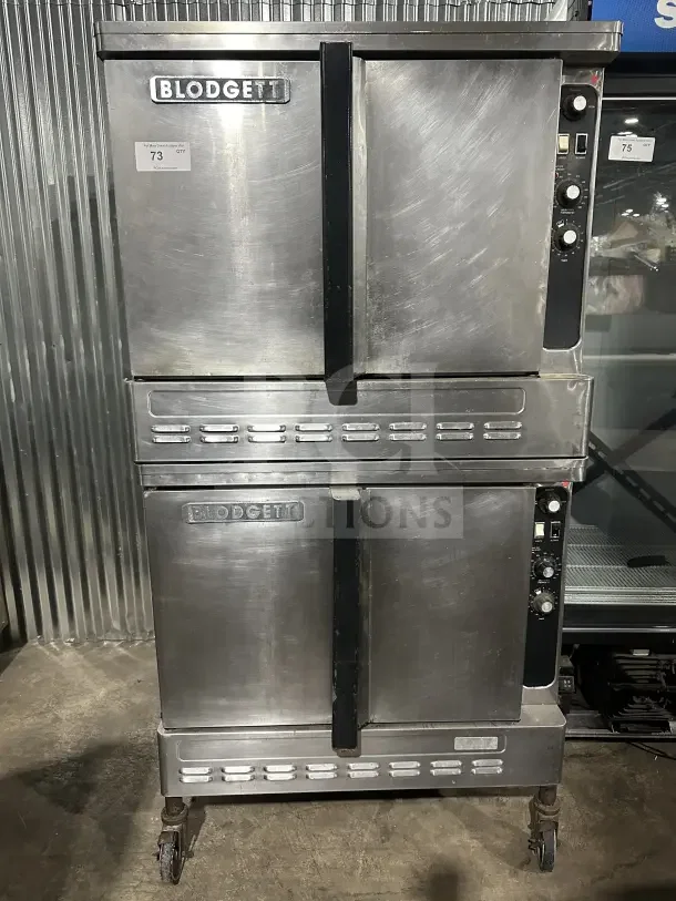 Blodgett stainless steel double stacked convection oven, gas-powered, with thermostatic controls, on casters, good condition.