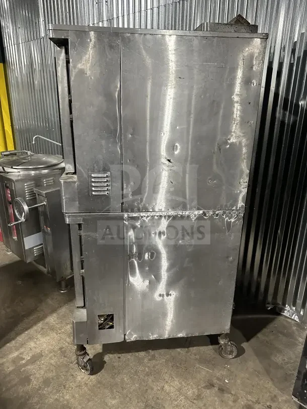 Blodgett stainless steel gas convection oven, double stacked, on casters, thermostatic controls, commercial use.