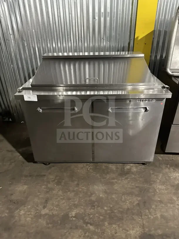 Kelvinator KCHMT418 stainless steel 2-door prep table on casters, excellent condition. Ideal for commercial use.