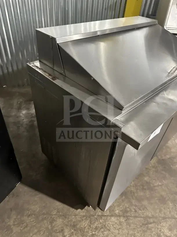 Kelvinator KCHMT418 stainless steel 2-door refrigerated prep table, commercial use, on casters, slight wear visible.