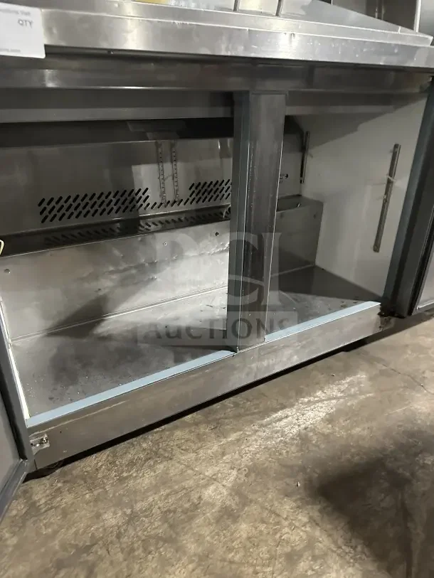 Kelvinator KCHMT418 stainless steel 2-door refrigerated prep table on casters. Model KCHMT418, SN: 014222002, used condition.