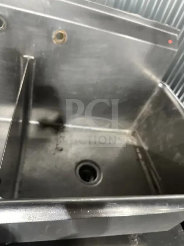 Commercial stainless steel 2-compartment scullery sink with legs, sturdy and durable for utility use.