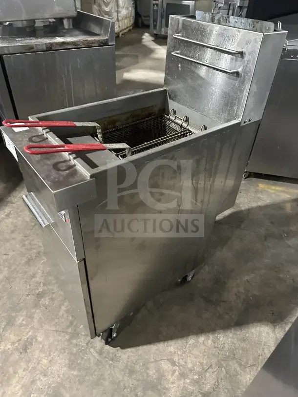 Connerton CSGF4ADT stainless steel 50 lb. commercial floor fryer on casters, with backsplash, basket hanger, and fry basket.