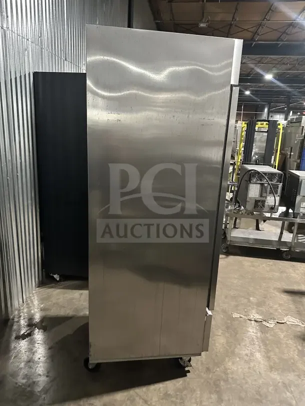 Beverage-Air Horizon Series 27" stainless steel commercial reach-in freezer, model HBF23HC-1, on casters, visible in industrial setting.