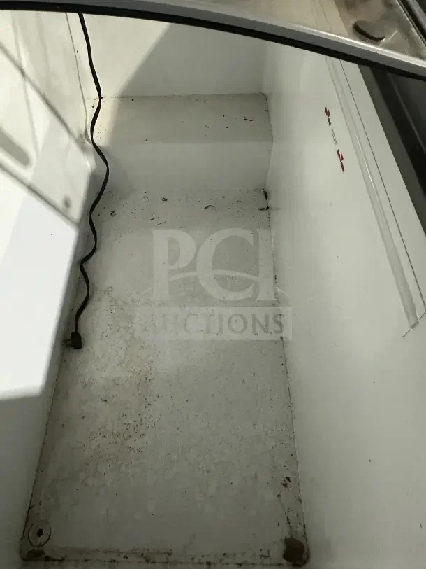 Ojeda USA NBH61 commercial white mobile glass top ice cream freezer, electric-powered. Visible interior wear, includes serial number 002735030815B.