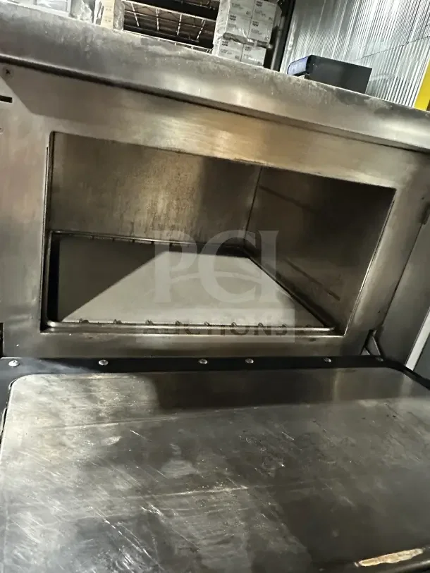 TurboChef Tornado Series stainless steel rapid-cook countertop oven, electric-powered, digital touch controls, on legs.