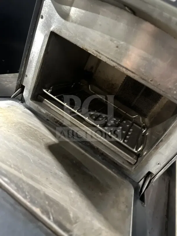 TurboChef NGO commercial rapid cook oven, electric-powered, digital controls, used condition, interior view, on legs.