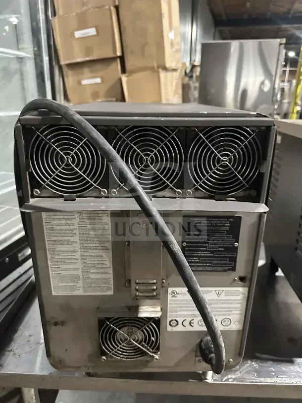 TurboChef NGO commercial electric rapid cook oven, model NGO014439, 208/240V, with digital controls, fan and vent details visible.