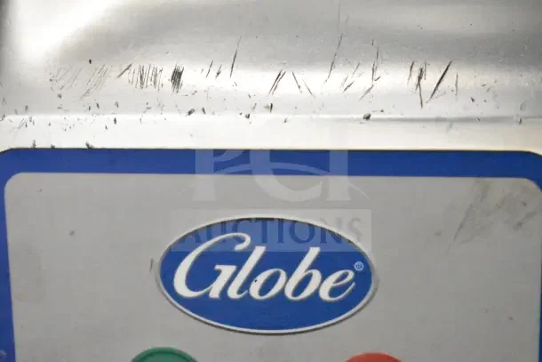 2021 Globe S13 commercial meat slicer, visible logo, operational wear, includes blade sharpener, 110V, 1 phase.