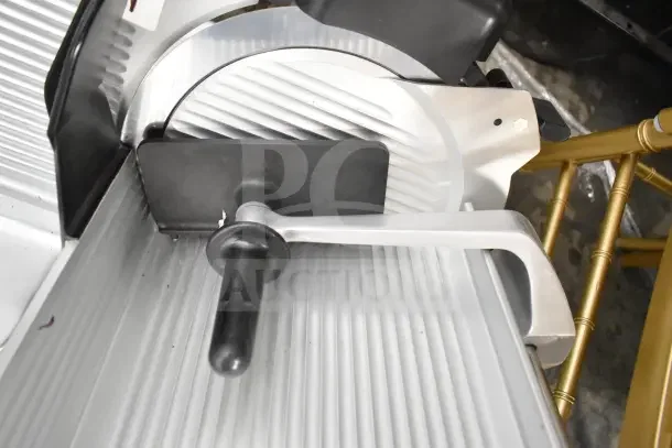 2021 Globe S13 commercial meat slicer with blade sharpener, 110 volts, 1 phase, in excellent condition.
