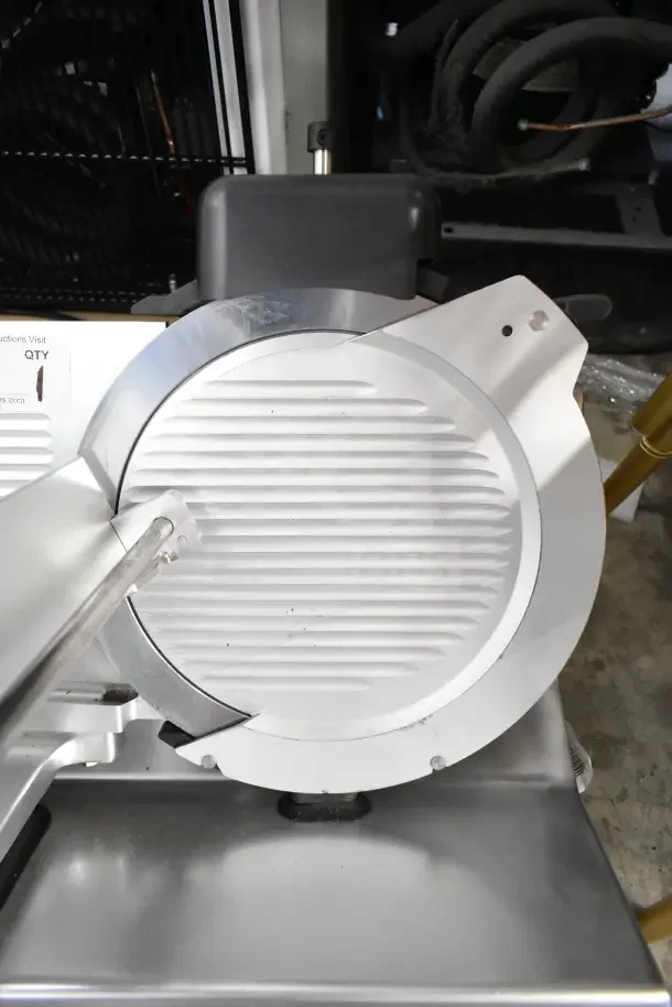 2021 Globe S13 commercial meat slicer with blade sharpener, 110V, 1 Phase. Visible blade and components in clean condition.