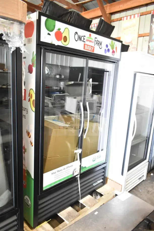 BRAND NEW SCRATCH AND DENT 2026 True TVM-48SL-HC Commercial 2 Door Reach-In Cooler, 115V, 1 Phase, graphics on top.