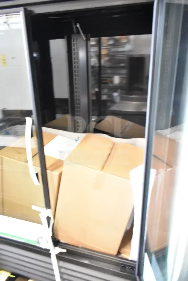 Brand new True TVM-48SL-HC commercial cooler, 2-door, slight scratches, 115V, 1 Phase, ideal for merchandise display.