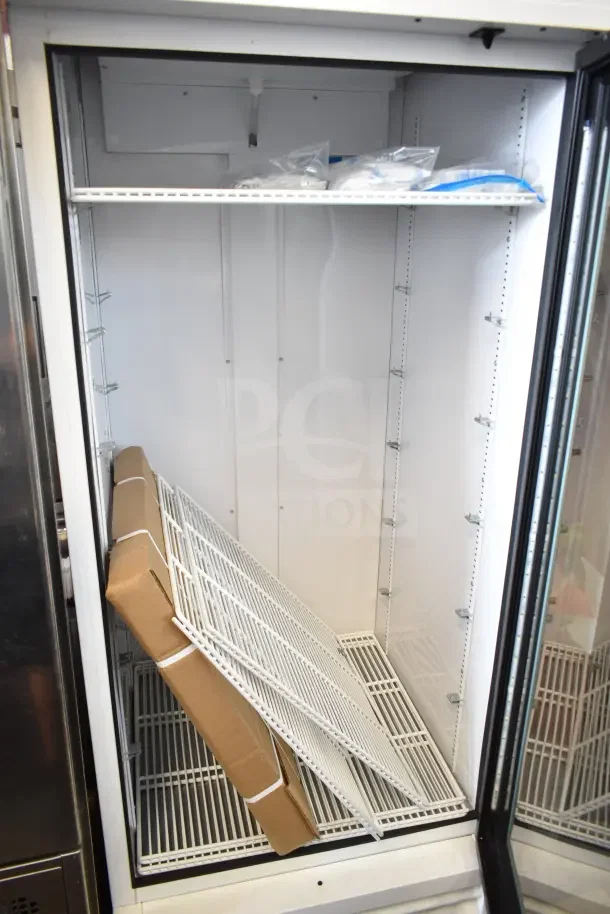 2021 True TSCI-600R-G-PH commercial single door reach-in cooler, new condition, includes shelves and original packaging.