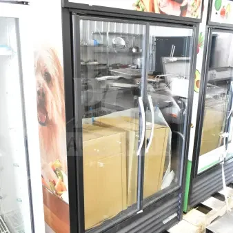 Brand new 2026 True TVM-48SL-HC commercial 2-door reach-in cooler, 115 volts, 1 phase. Visible scratches and dents.