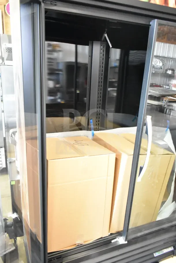 Brand new True TVM-48SL-HC cooler merchandiser, scratch and dent condition, 115 volts, 1 phase, dual glass doors.