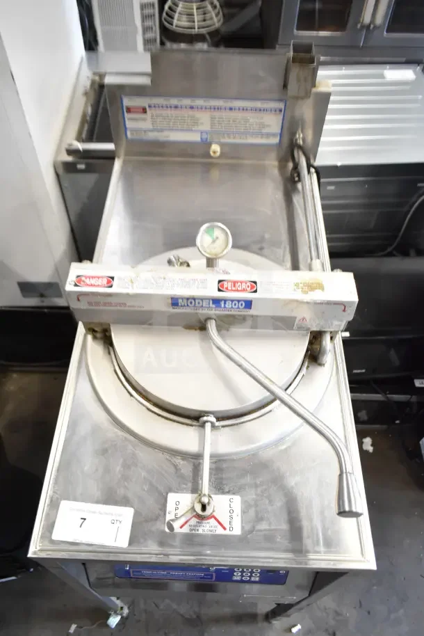 Broaster 1800 gas-powered pressure fryer, commercial floor style. Features visible control panel and pressure valve. Good condition.