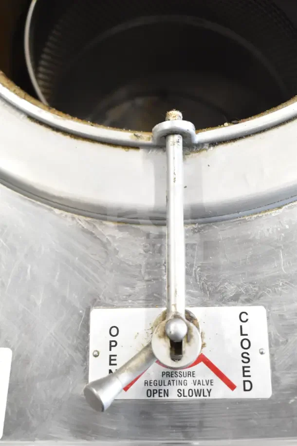 Broaster 1800 commercial gas pressure fryer with pressure regulating valve control labeled for open and closed positions.