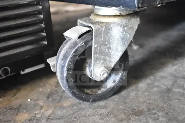 2016 True T-35 Commercial Cooler caster, showing durable metal and rubber wheel. Model T-35, 115V, 1 Phase.