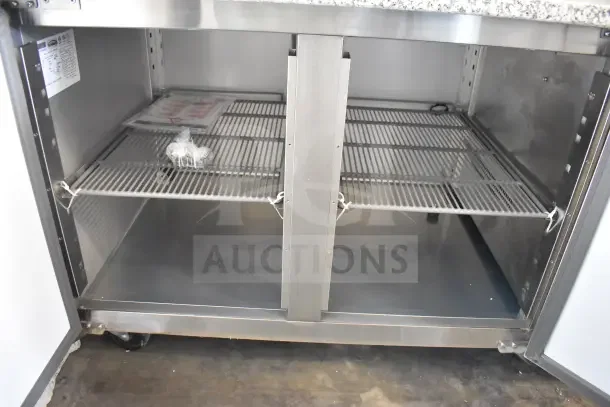 KoolMore 59" commercial refrigerated granite pizza prep station with stainless steel pan holder, model KM-RPPS-2D59-GRT, on casters.