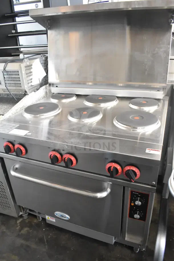 Brand new KoolMore KM-CR36-E commercial electric range, six burners, one electric oven, minor scratches and dents visible.
