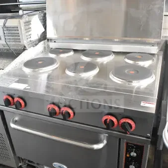 Brand new KoolMore KM-CR36-E commercial electric range, six burners, one electric oven, minor scratches and dents visible.
