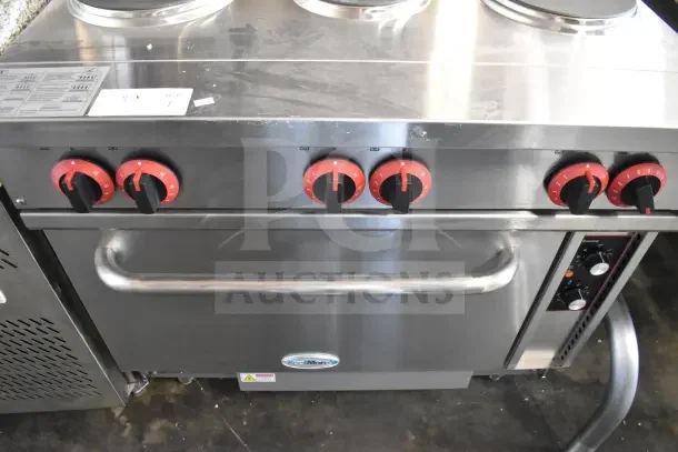 BRAND NEW KoolMore KM-CR36-E commercial range with 6 burners, electric oven, red knobs, minor scratches visible.