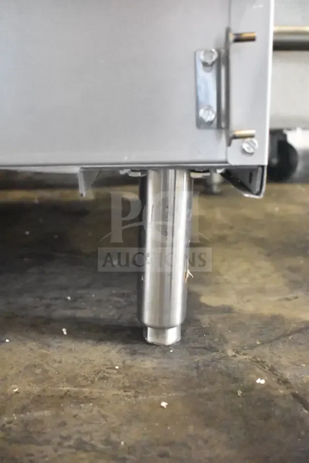 BRAND NEW SCRATCH AND DENT KoolMore KM-CR36-E range leg, stainless steel with visible marks, commercial-grade.