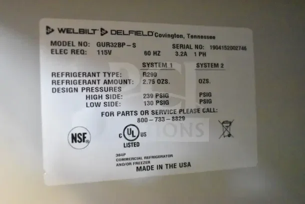 Label on 2019 Delfield GUR32BP-S cooler showing model, refrigerant type R290, 115V, and design pressures. Made in USA.