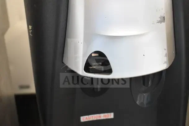 SOBP210ESNS Top Load Water Cooler, 115V, 1 Phase. Some visible wear on surface. "CAUTION-HOT" label displayed.