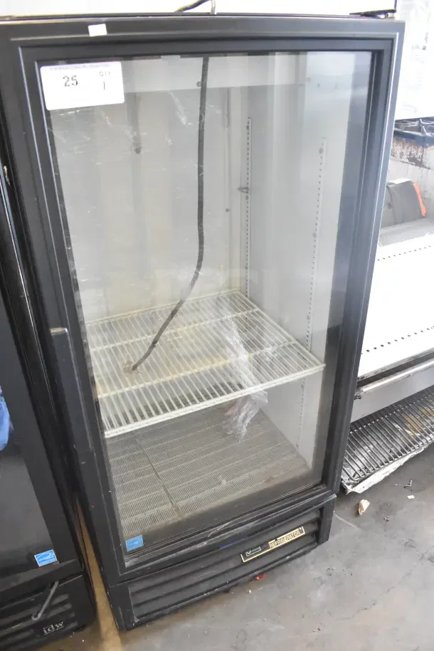 True GDM-10-HC-LD mini cooler merchandiser, black, glass door, 115 volts, visible power cord, good condition, model label.