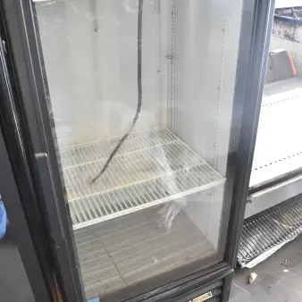True GDM-10-HC-LD mini cooler merchandiser, black, glass door, 115 volts, visible power cord, good condition, model label.