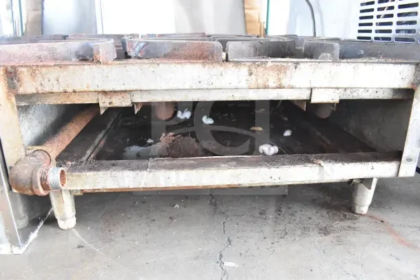 Star Max commercial countertop gas-powered 4 burner range, showing heavy rust and wear, requires restoration.