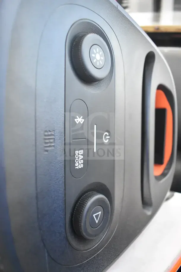 JBL Partybox 110 Portable Bluetooth Speaker with bass boost and control buttons. Brand logo visible. Store display condition.
