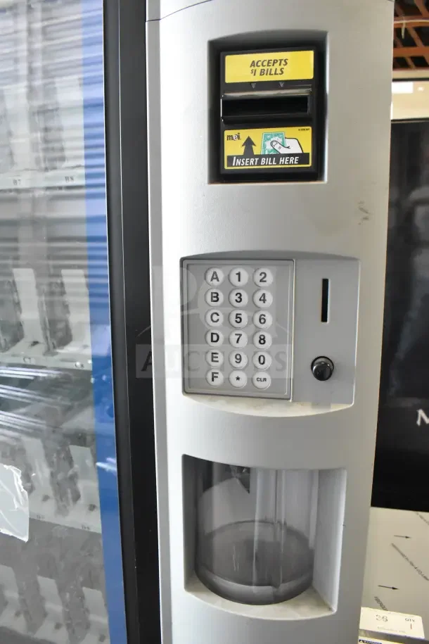 Crane 5800-4HC vending machine with bill acceptor, keypad, and glass display; 115 volts, 1 phase.