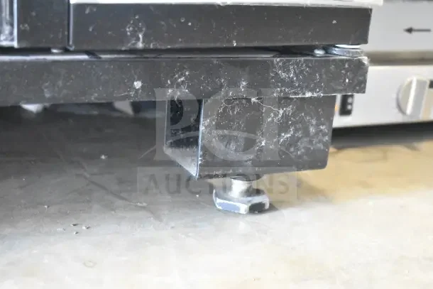 Crane 5800-4HC vending machine base, showing casters and frame. Condition needs cleaning. 115 volts, 1 phase.