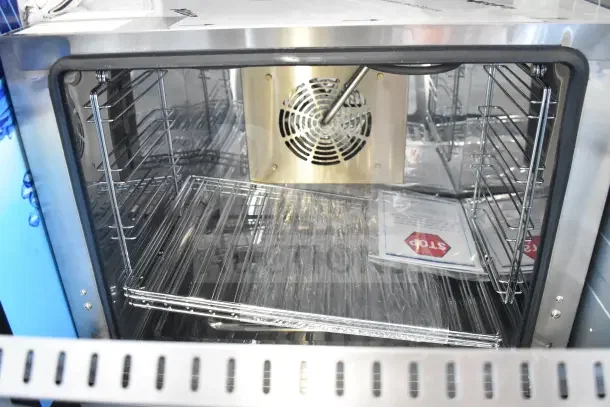 Brand new KoolMore KM-CTCO-23STI 23" countertop convection oven, four racks, steam injection, 2800W, visible fan, tags included.
