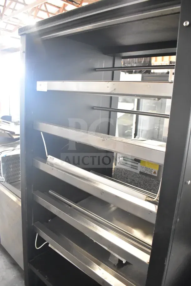 Lakeside commercial bakery transport rack with shelves and commercial casters. Black frame, stainless steel rails, good condition.