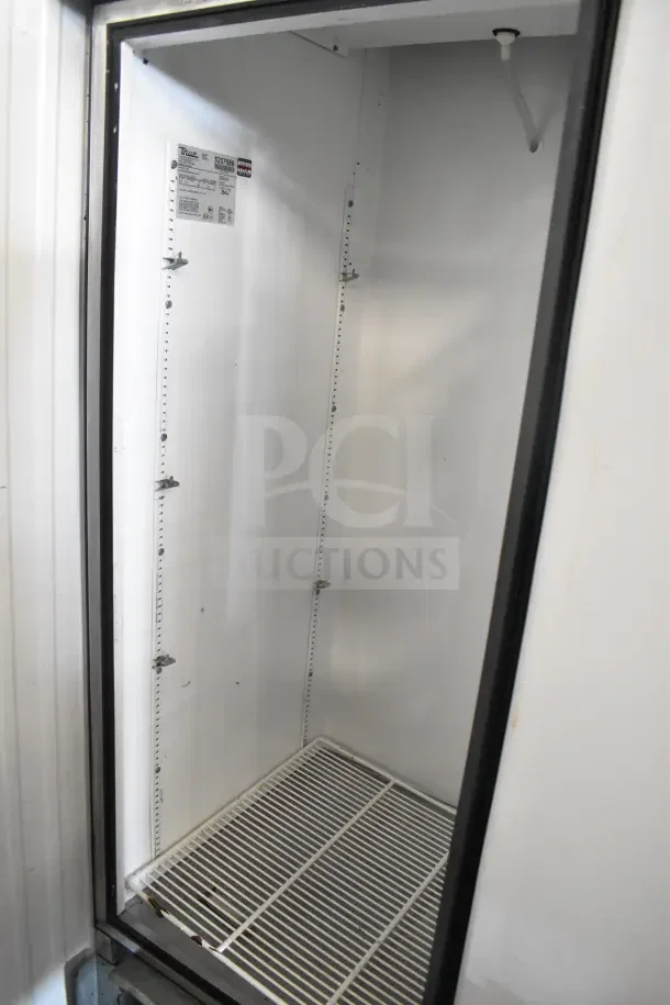True T-23 Commercial Single Door Reach In Cooler, white interior, 115 volts, 1 phase, open door view, clean condition.