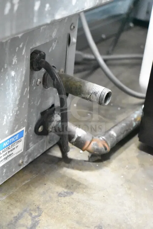 Hoshizaki F-330BAJ undercounter flaked ice machine, 115V, 1 phase, visible wear, notice tag on plastic fitting.