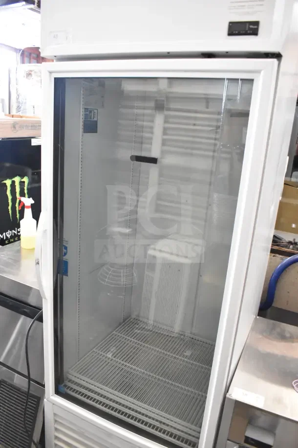 2021 True TSCI-600R-G-PH single door cooler merchandiser, 115 volts, 1 phase, excellent condition, glass front.