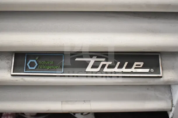 "True" brand logo with "natural refrigerant" label on a 2021 TSCI-600R-G-PH commercial cooler.