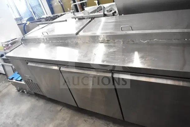 2023 Avantco MPR-93-X commercial pizza prep table, stainless steel, with hinged lids, on casters, 115V, 1 phase.