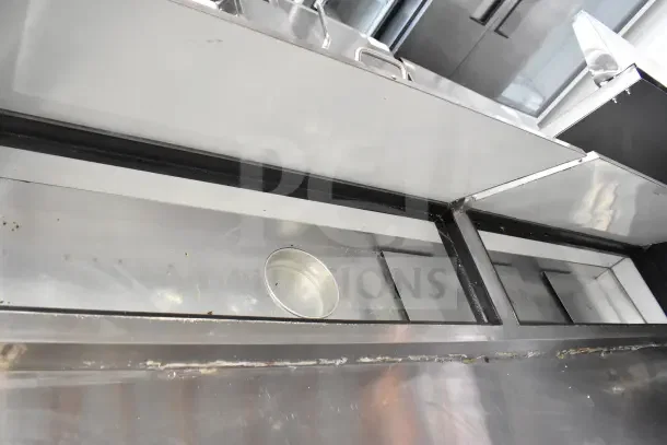 2023 Avantco MPR-93-X commercial pizza prep table, stainless steel, with casters, visible wear, 115V, 1 phase.